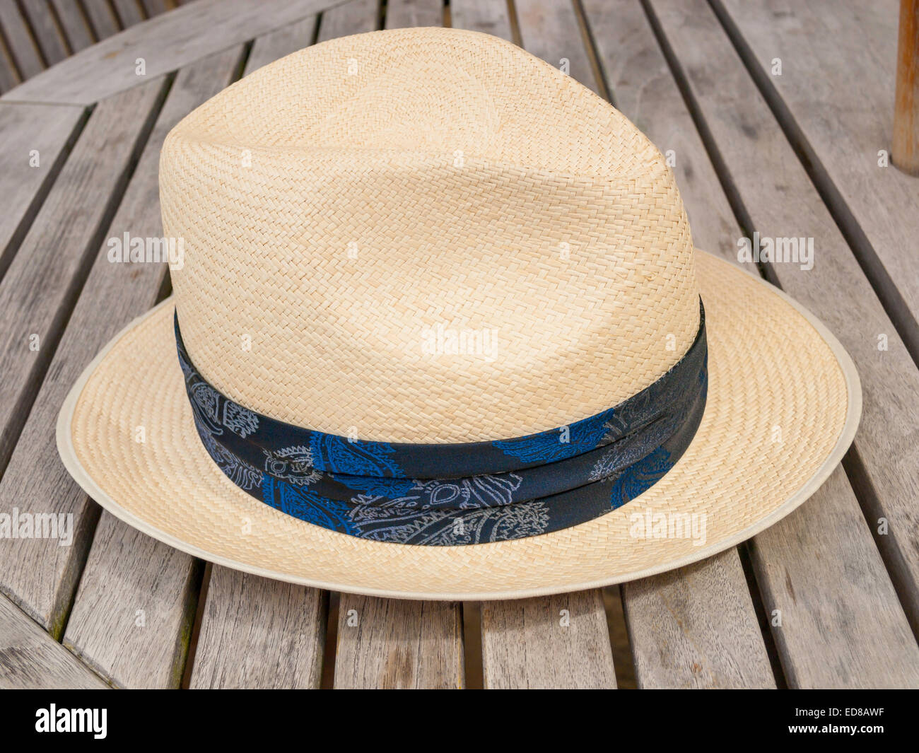 A gentleman's Panama Hat on an outdoor café table Stock Photo