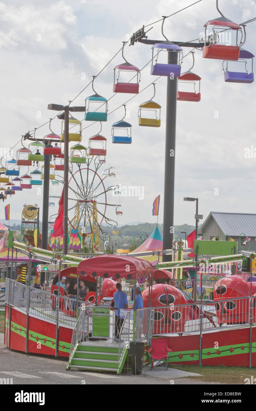 People enjoy the colorful North Carolina Mountain State Fair rides Stock Photo