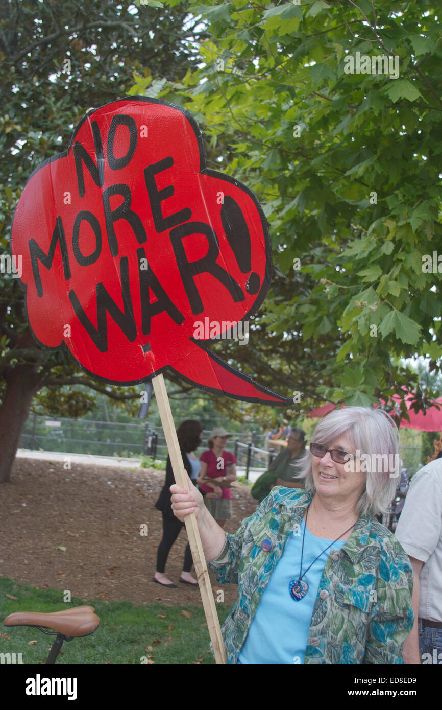A woman holds a sign saying 'No More War' at a Moral Monday rally in Asheville, North Carolina Stock Photo