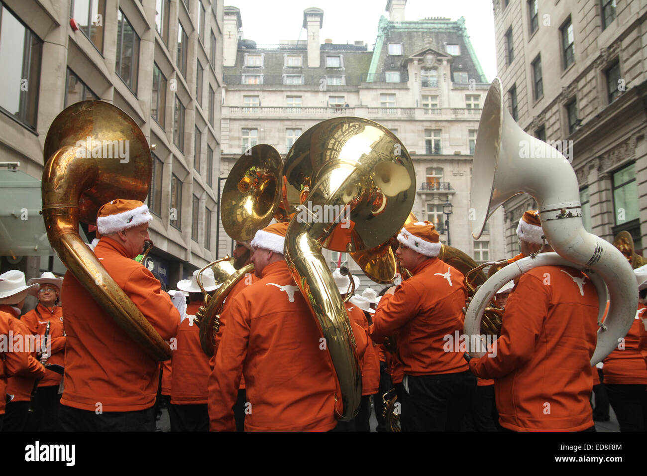 London, UK. 1 January 2015. University of Texas Longhorn band members do a final rehearsal ahead of the parade start at noon. Londoners and tourists turned up in droves for the new years parade. The annual parade goes through Piccadilly, Regents street, Pall Mall and Whitehall a 2 mile route. Photo: David Mbiyu/ Alamy Live News Stock Photo