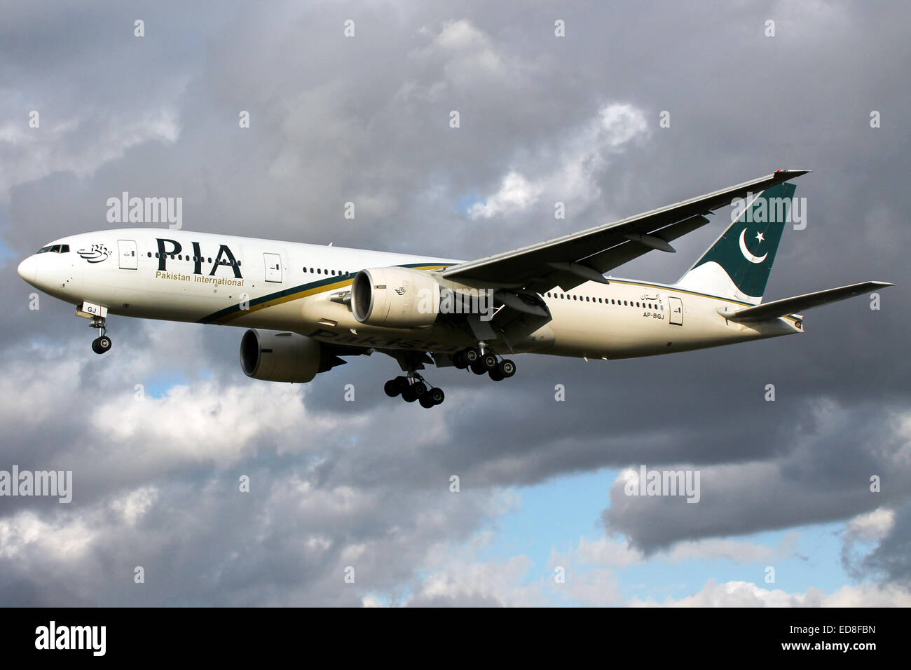 Pakistan International Airlines Boeing 777-200 approaches runway 27L at London Heathrow airport. Stock Photo
