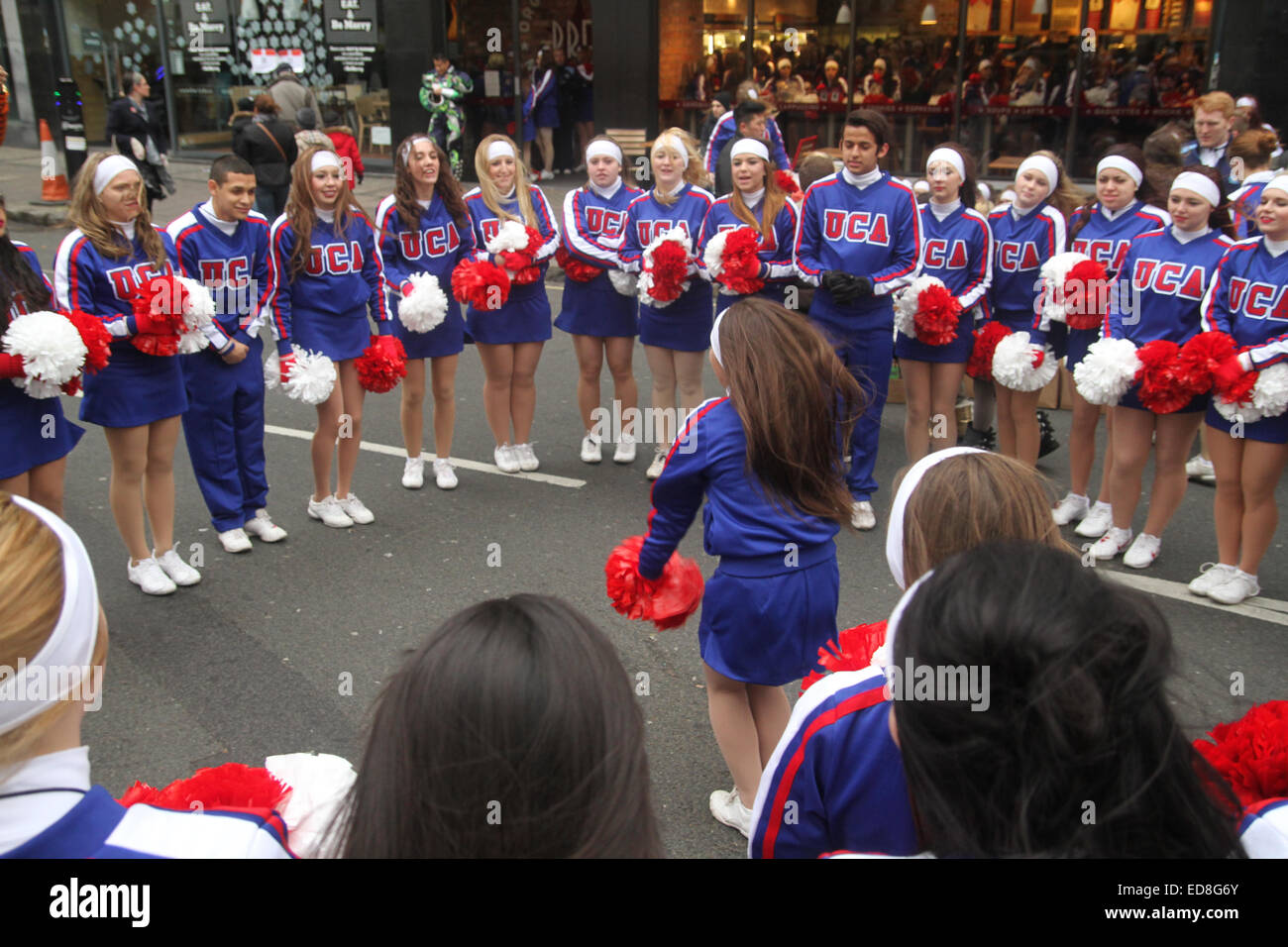 London, UK. 1 January 2015. UCA cheer leaders rehearse ahead of the London New years parade. Londoners and tourists turned up in droves for the new years parade. The annual parade goes through Piccadilly, Regents street, Pall Mall and Whitehall a 2 mile route. Photo: David Mbiyu/ Alamy Live News Stock Photo