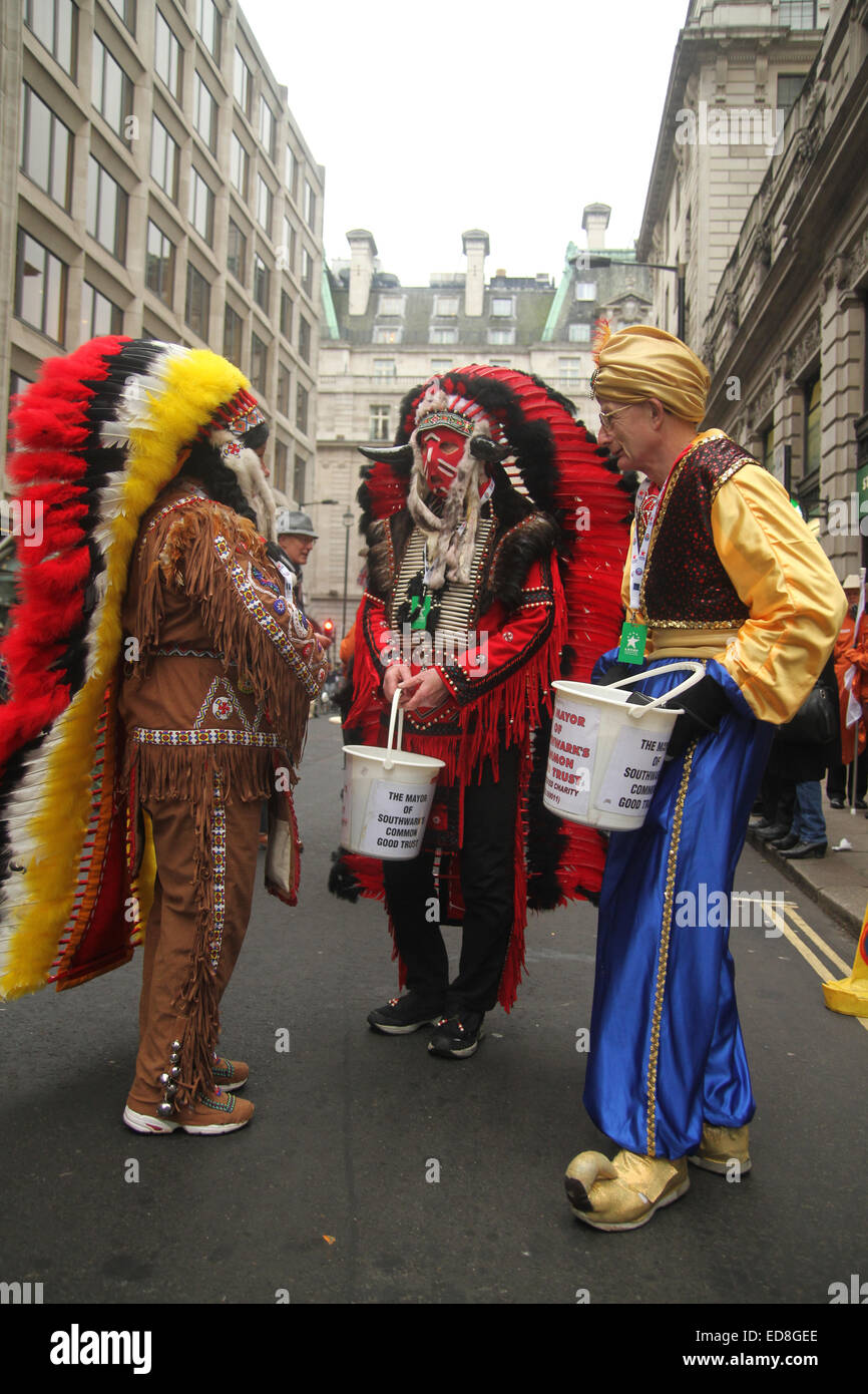 London, UK. 1 January 2015. Charity fundraisers in American Indian feathered costumes seen at Berkeley Street ahead of the parade. Londoners and tourists turned up in droves for the new years parade. The annual parade goes through Piccadilly, Regents street, Pall Mall and Whitehall a 2 mile route. Photo: David Mbiyu/ Alamy Live News Stock Photo