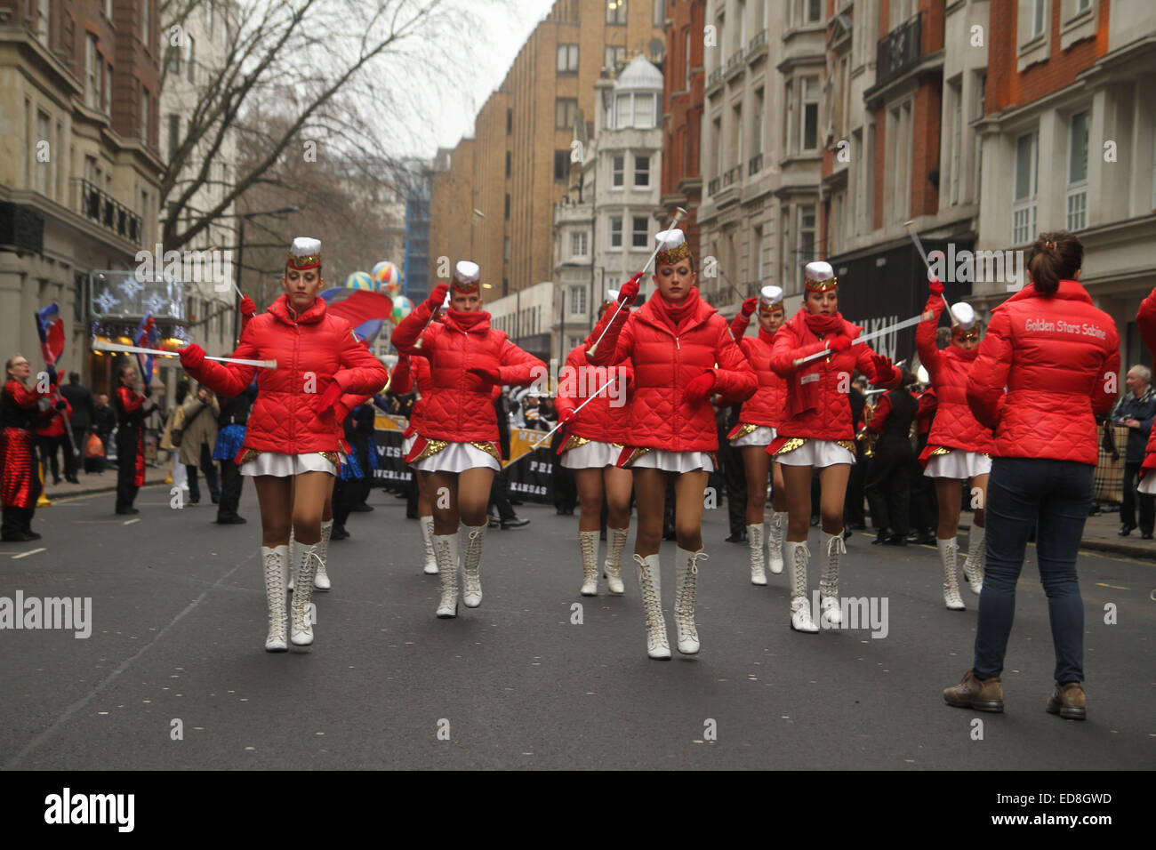 London, UK. 1 January 2015. Italian Cheerleaders the Golden Stars Sobine rehearse ahead of  the annual London new years parade. Londoners and tourists turned up in droves for the new years parade. The annual parade goes through Piccadilly, Regents street, Pall Mall and Whitehall a 2 mile route. Photo: David Mbiyu/ Alamy Live News Stock Photo