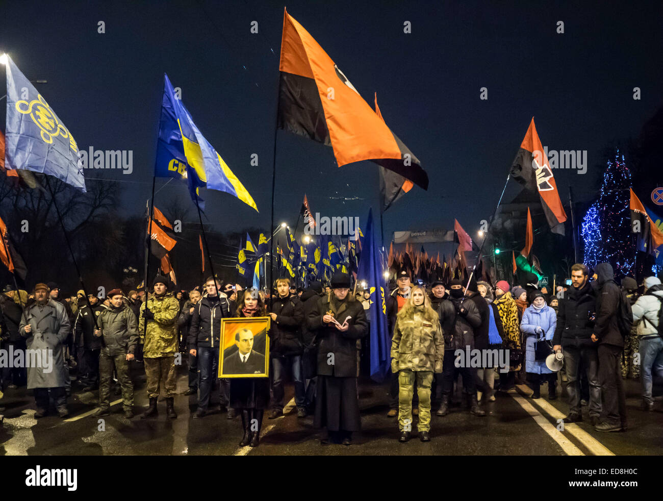 Kiev, Ukraine. 1st January, 2015. The torchlight procession in honor of the birthday of Stepan Bandera was held in the city center. It was attended by about four thousand people - more than two times less than a year ago. In the march was attended by two parties - 'Freedom' and recognized in the Russia extremist 'Right sector. Credit:  Igor Golovnov/Alamy Live News Stock Photo