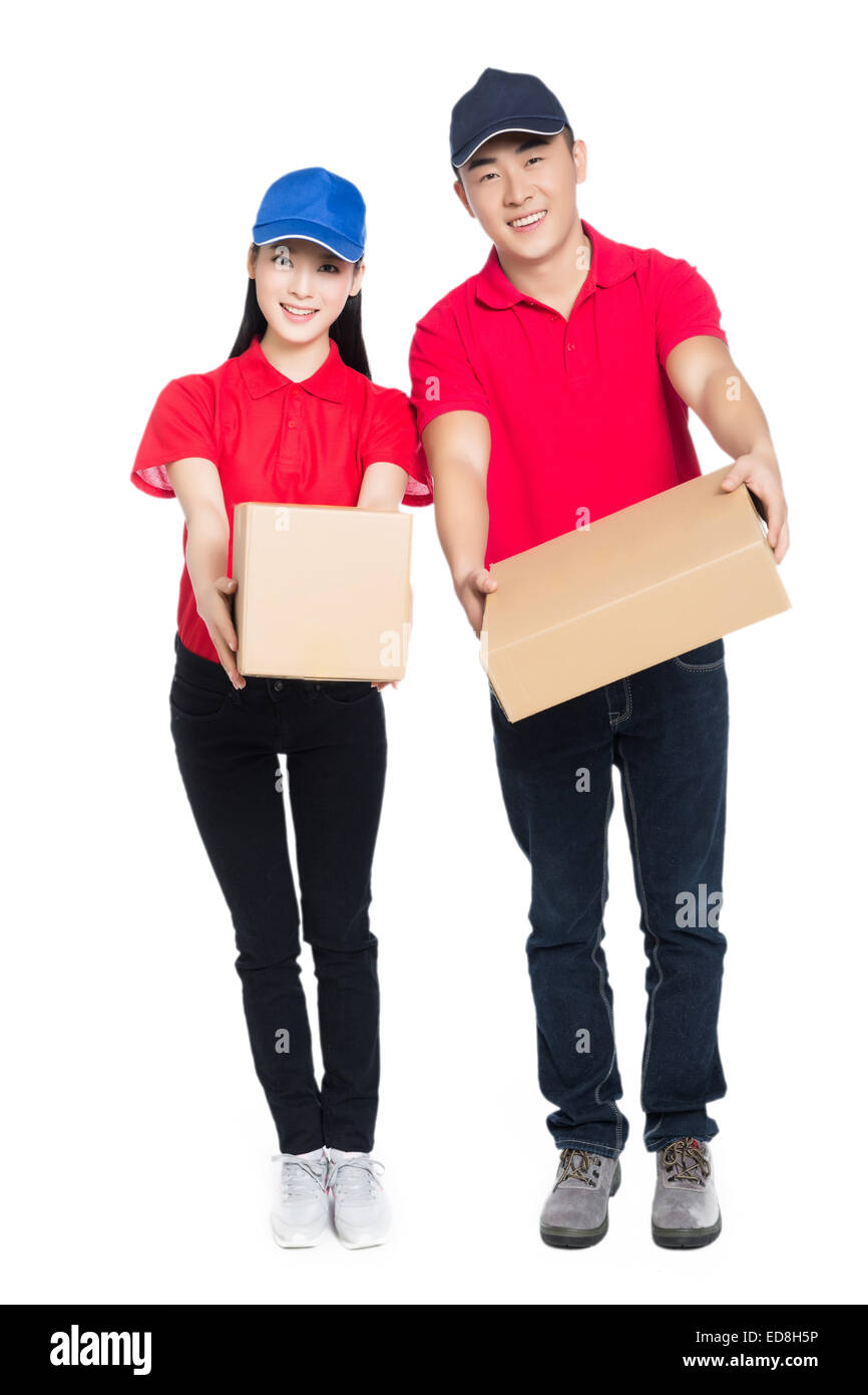 delivery mailman carrying cardboard box, white background. Stock Photo
