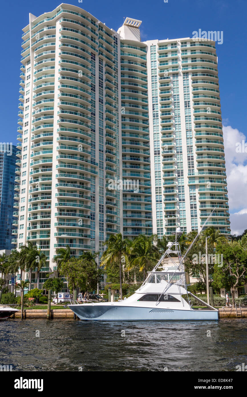 Ft. Lauderdale, Florida.  Pleasure Boat Parked in front of Water Garden Condominium on New River. Stock Photo