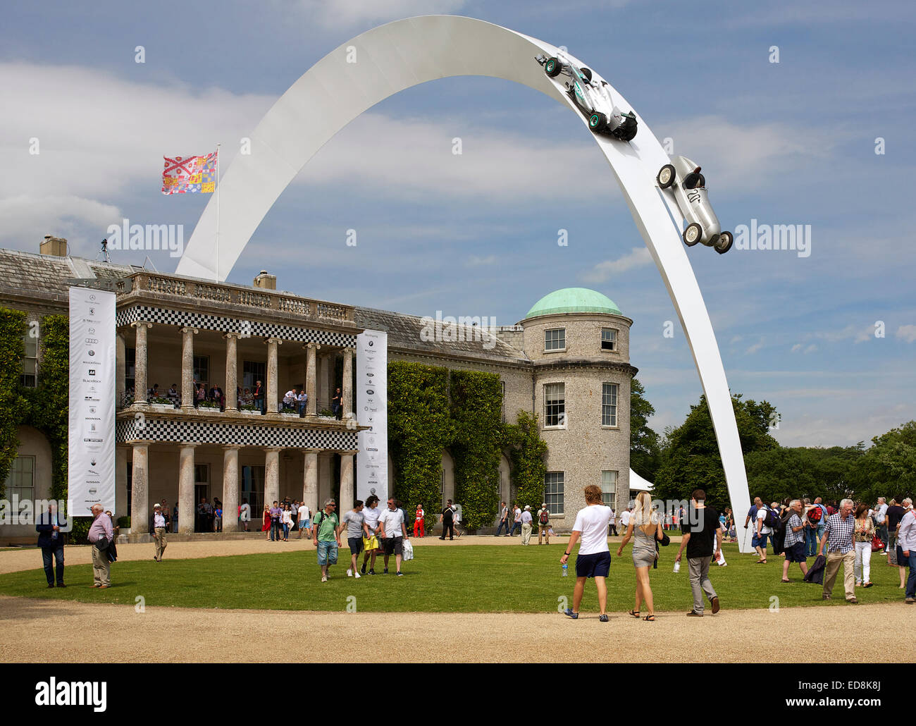 Mercedes F1 W04 2013 racing car and 1934 Mercedes-Benz W25 racing car, on the sculpture by Gerry Judah, which arcs over Goodwood House Stock Photo