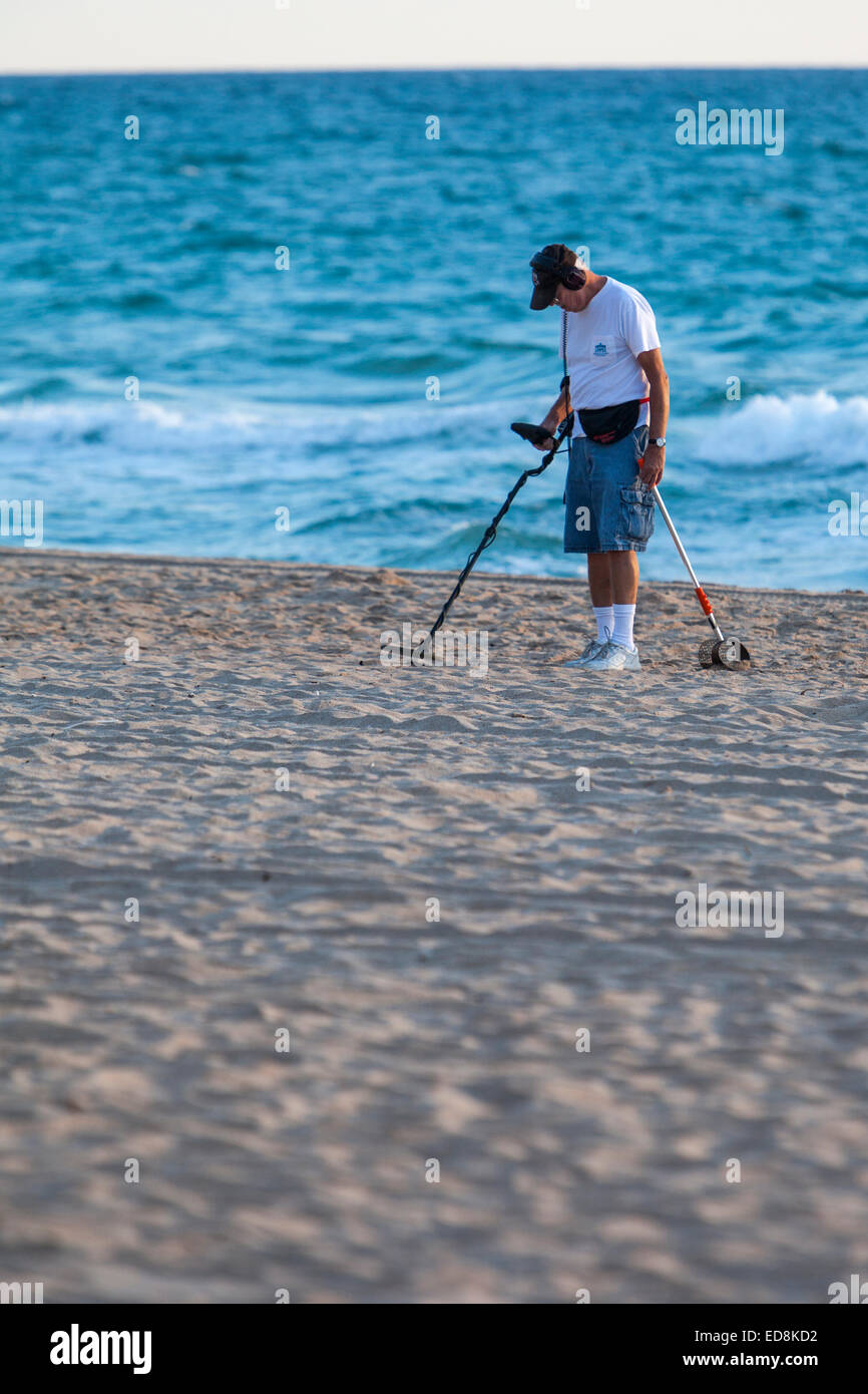 Ft. Lauderdale, Florida.  Early-morning Beachcomber with Metal Detector. Stock Photo