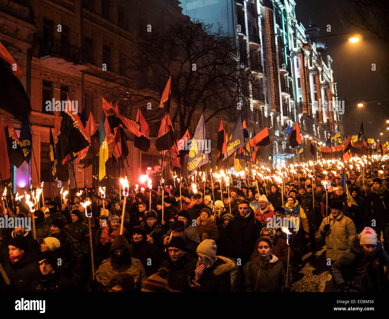 Kiev, Ukraine. 1st January, 2015. Kiev, January 1, 2015. The torchlight procession in honor of the birthday of Stepan Bandera was held in the city center. It was attended by about four thousand people - more than two times less than a year ago. In the march was attended by two parties - 'Freedom' and recognized in the Russia extremist 'Right sector.' Credit:  Igor Golovnov/Alamy Live News Stock Photo