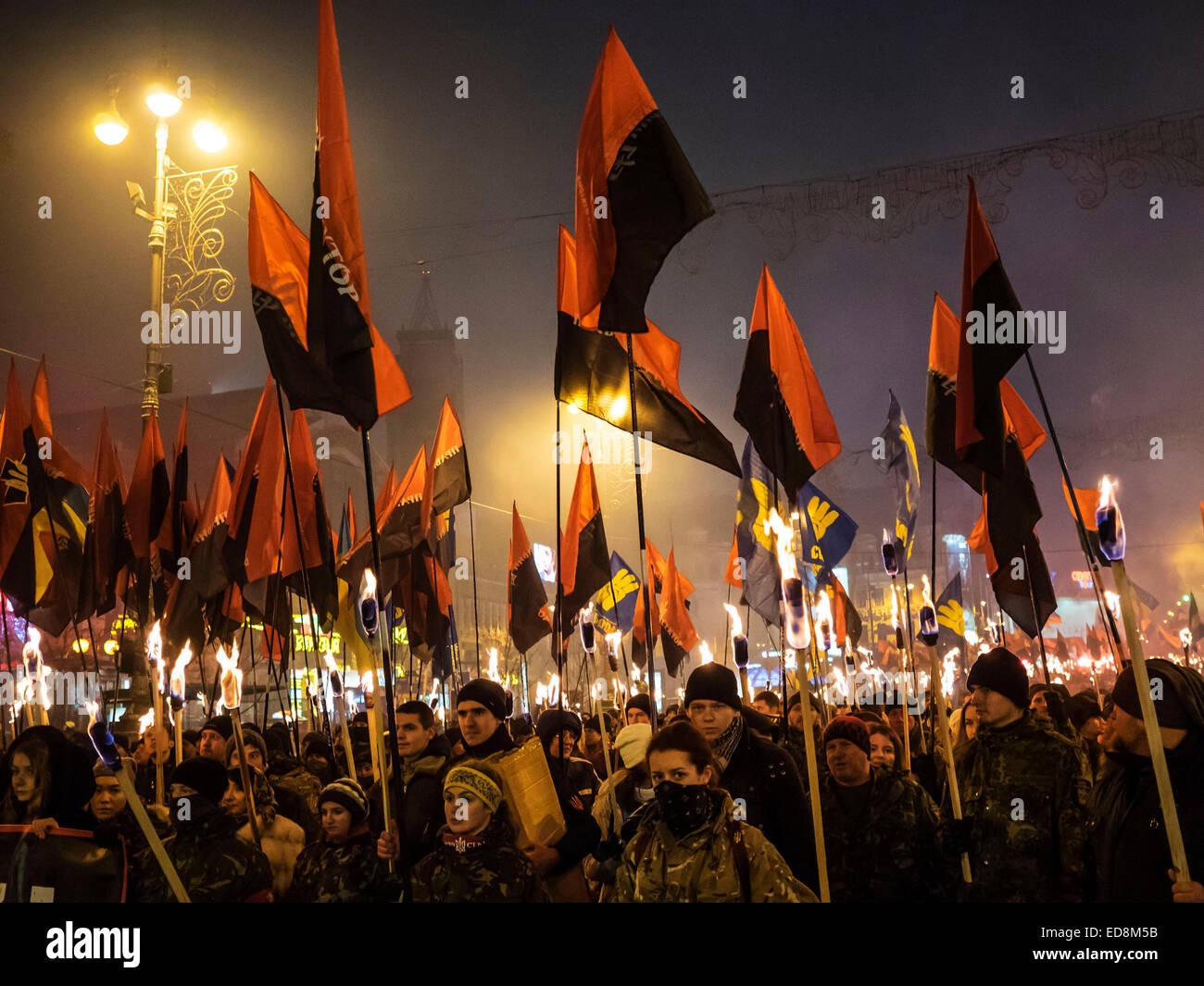Kiev, Ukraine. 1st January, 2015. Kiev, January 1, 2015. The torchlight procession in honor of the birthday of Stepan Bandera was held in the city center. It was attended by about four thousand people - more than two times less than a year ago. In the march was attended by two parties - 'Freedom' and recognized in the Russia extremist 'Right sector.' Credit:  Igor Golovnov/Alamy Live News Stock Photo