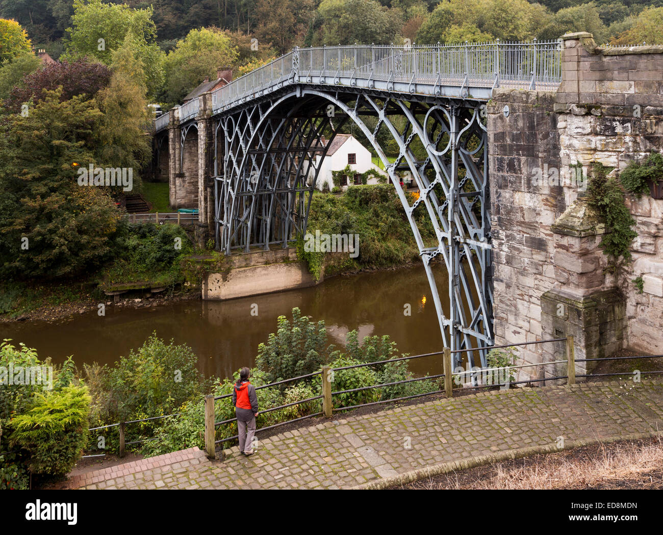 Person looking at the bridge over the river severn at Ironbridge, Shropshire, UK Stock Photo