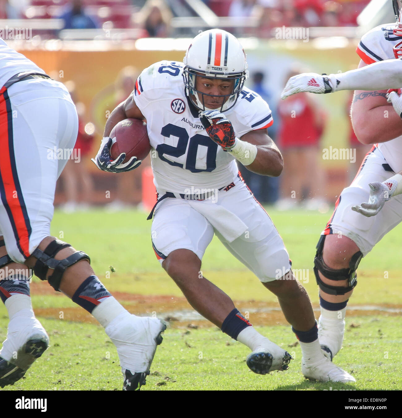 Tampa, FL, USA. 1st Jan, 2015. Auburn's Corey Grant 20 finds a hole in