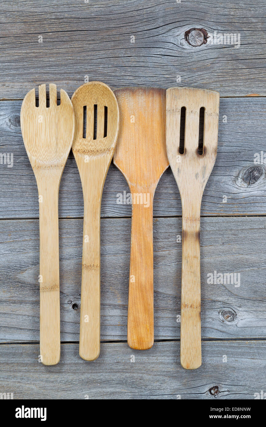 https://c8.alamy.com/comp/ED8NNW/vertical-image-of-old-wooden-cooking-utensils-on-rustic-wood-ED8NNW.jpg