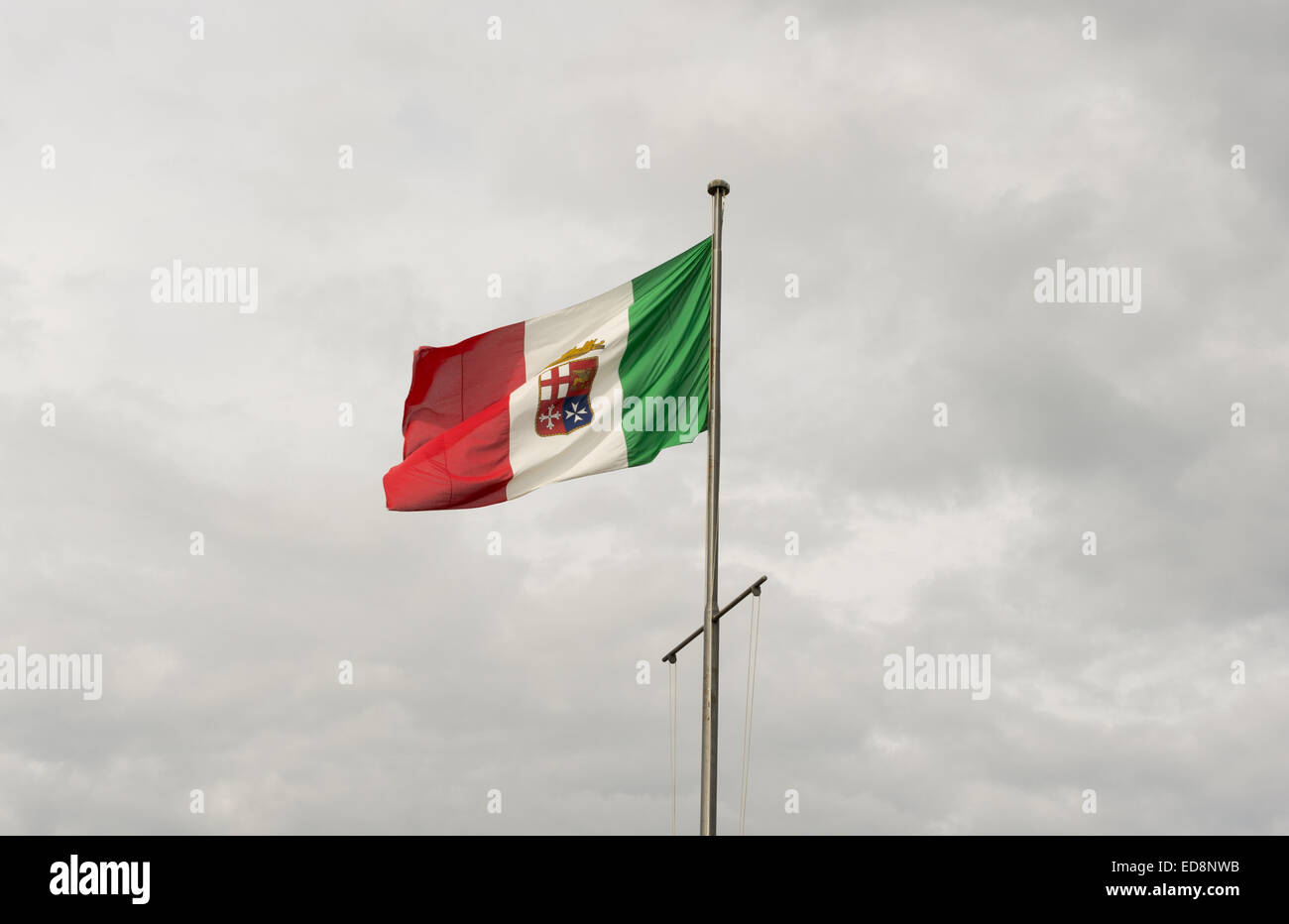 Flag of the Italian Navy flies in the sky over Cagliari Stock Photo