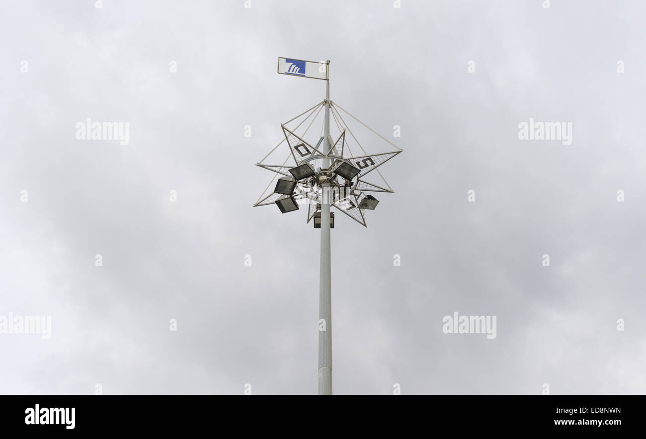 lighting tower with an indication of the cardinal points in the port of Cagliari Stock Photo