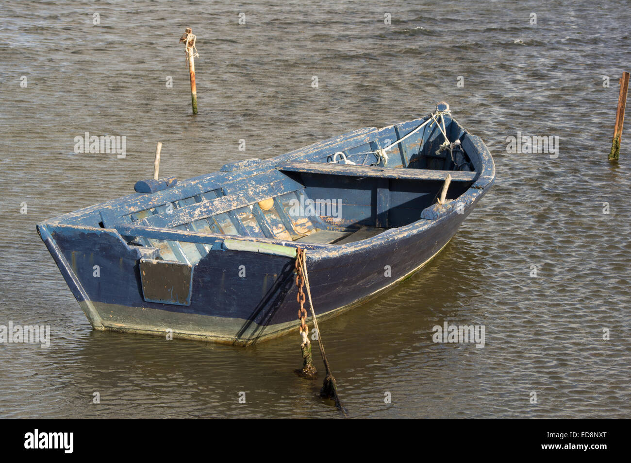 Fishing boat anchored in the pond Stock Photo