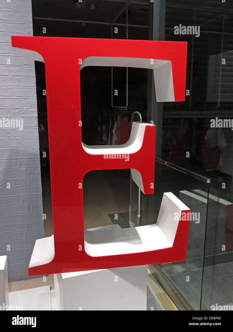 A big red letter E at night in a shop window, the best vowel Stock Photo