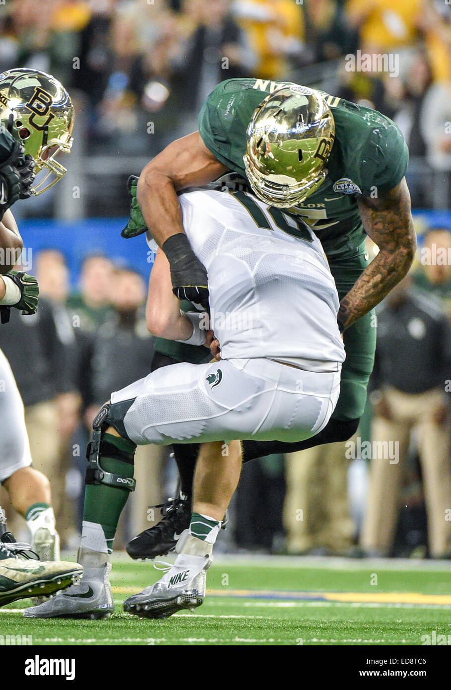 Arlington, Texas, USA. 1st January, 2015. Baylor Bears defensive end Shawn Oakman (2) sacks Michigan State Spartans quarterback Connor Cook (18).during the 79th Goodyear Cotton Bowl Classic game between the Michigan State Spartans and Baylor Bears January 1st, 2015, at the AT&T Stadium in Arlington, Texas. Credit:  Cal Sport Media/Alamy Live News Stock Photo