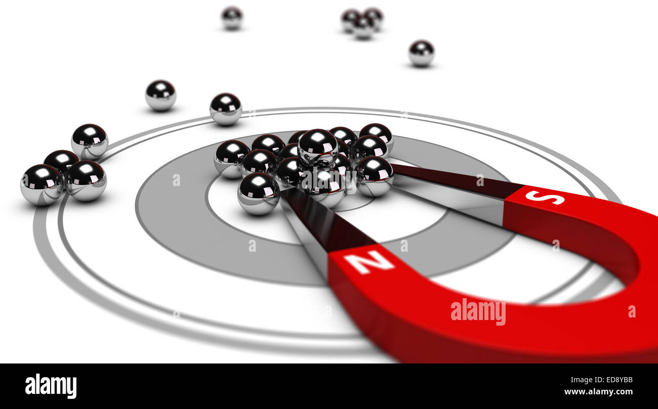 Horseshoe magnet attracting metal balls in the center of a grey target. Image concept of inbound marketing or advertising. Stock Photo