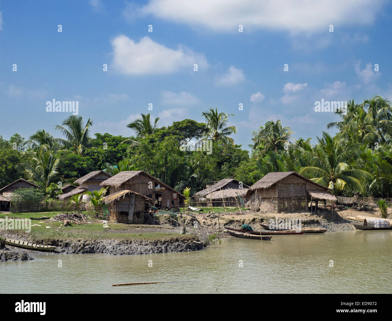 Rural village on the banks of a tributary to the Kaladan River in the northwestern part of Rakhin State, Myanmar Stock Photo