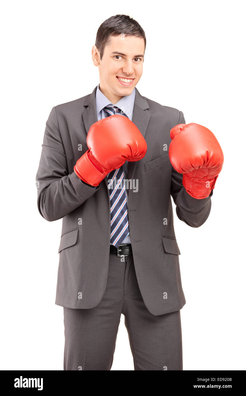 Vertical shot of a competitive businessman with boxing gloves isolated on white background Stock Photo