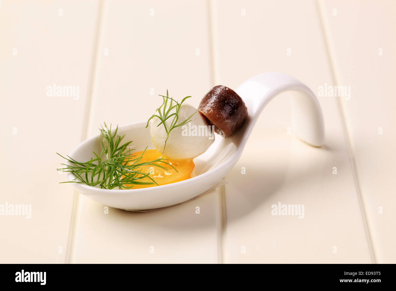 Mozzarella cheese ball and rolled anchovy fillet Stock Photo