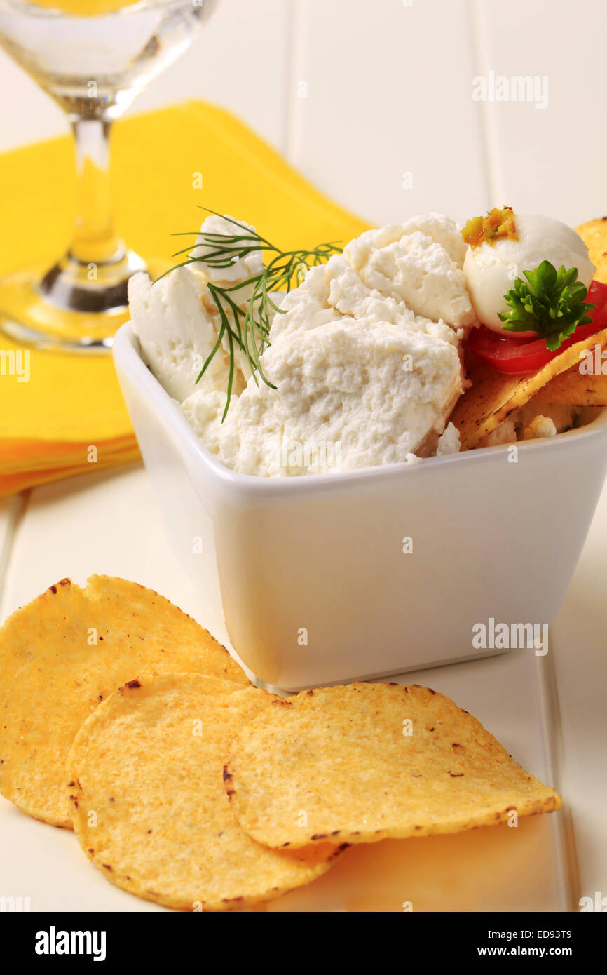 Corn chips and bowl of curd cheese Stock Photo Alamy