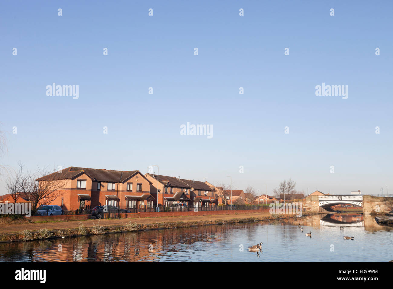 Houses stand along the Leeds and Liverpool Canal near Stanley Dock in