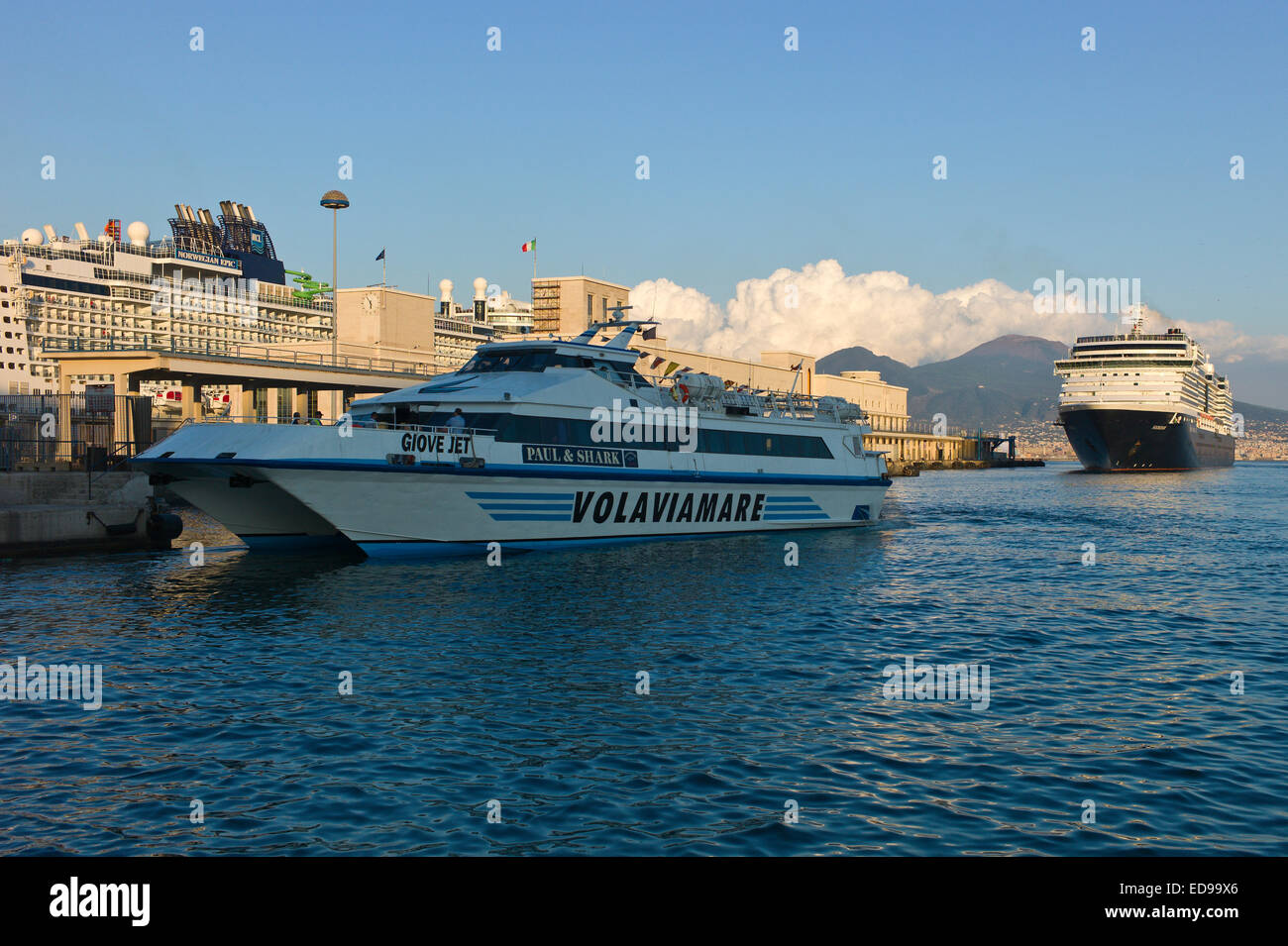 Passenger ferry and cruise ship 'MS Noordam' in the port at Naples with Vesuvius behind. Naples, Campania, Italy Stock Photo