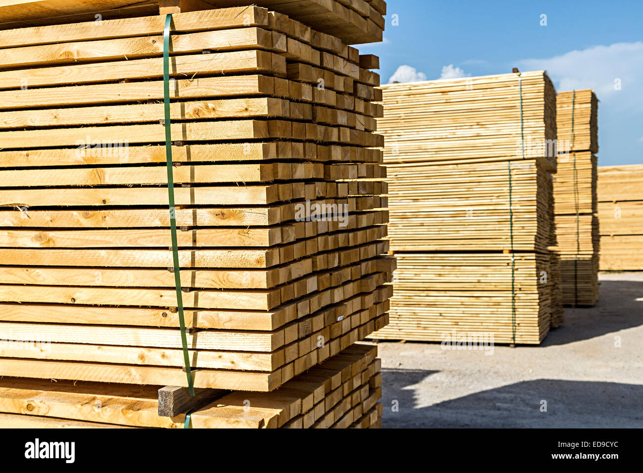 Sawn and planed stacked timber in sawmill yard, Cerknica, Slovenia Stock Photo