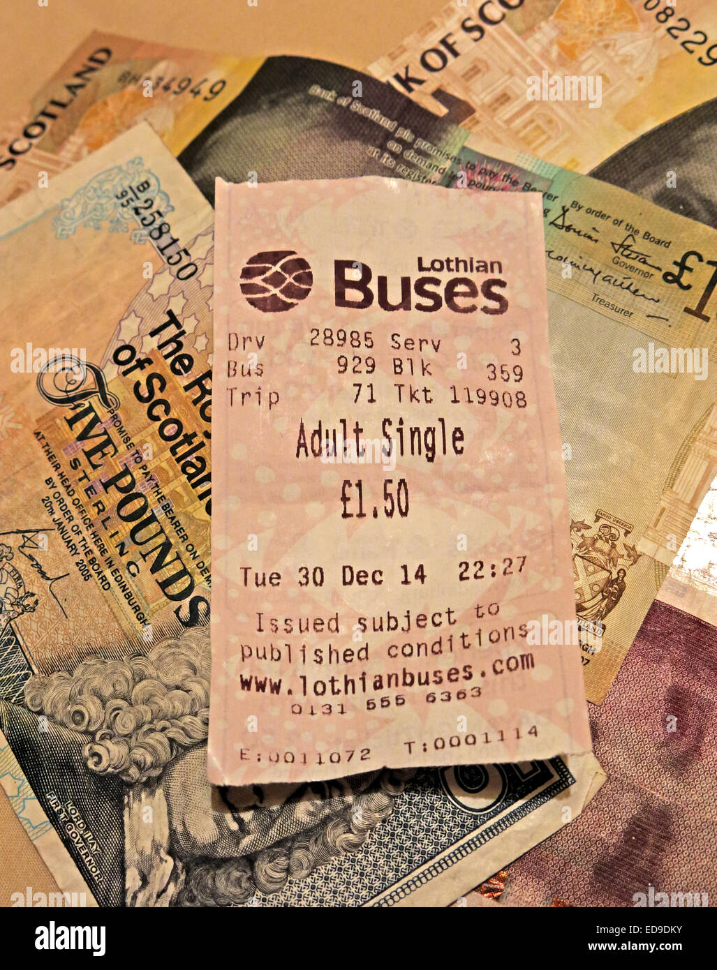Lothian Buses bus Ticket and Scots banknotes from Edinburgh, Scotland, UK portrait format Stock Photo