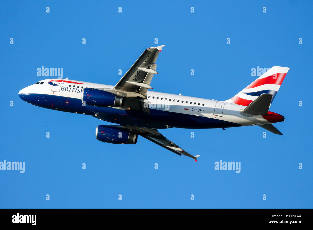 British Airways Airbus A319 climbs away from runway 27L at London Heathrow airport. Stock Photo