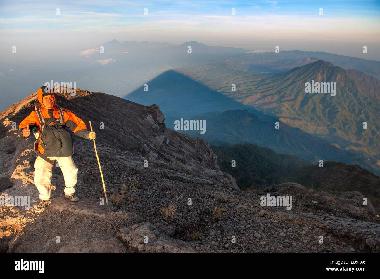 Balinese guide on the path leading to the summit of Gunung Agung (3142m), the highest volcano on the island of Bali, Indonesia. Stock Photo