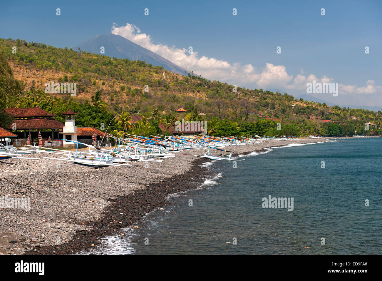 View of Mount Agung (3142) and Jemulek beach near Amed on the northeast coast of Bali, Indonesia. Stock Photo