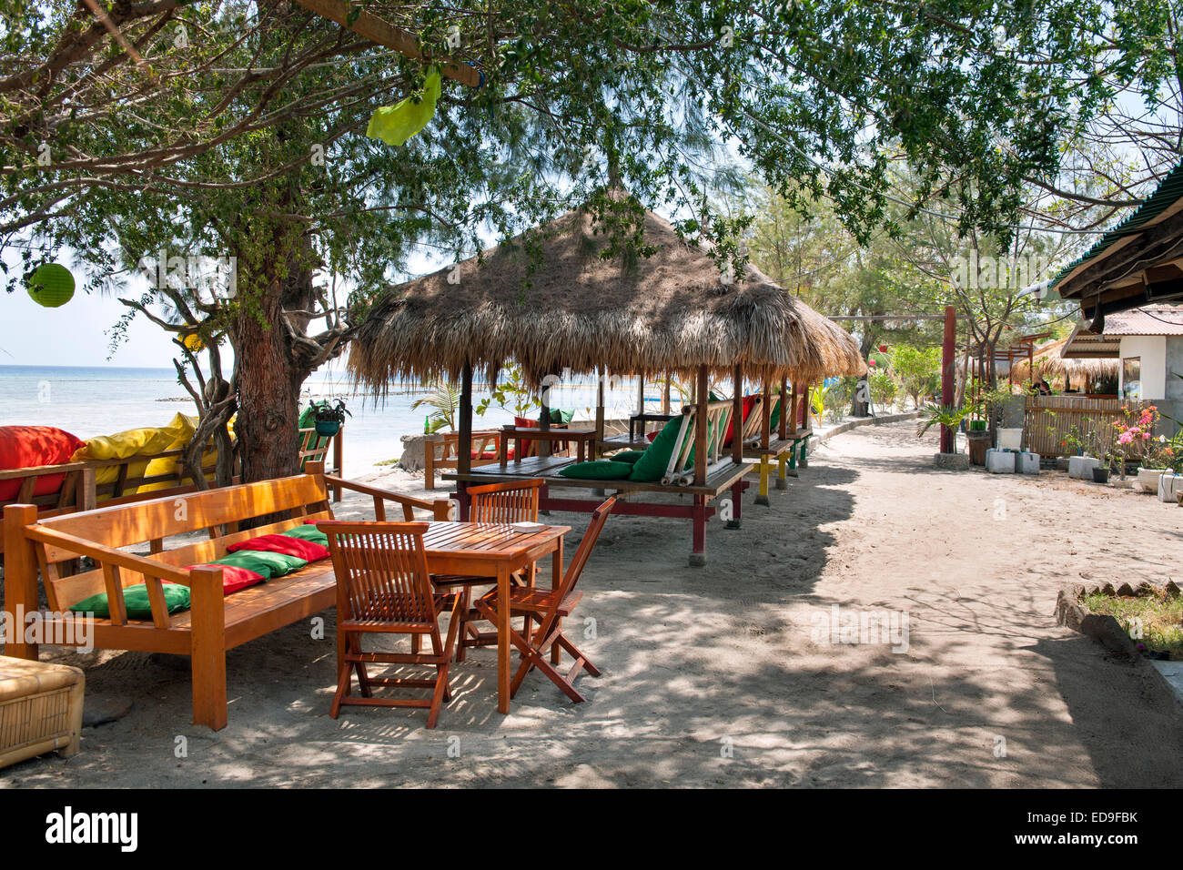 Beach loungers on Gili Air island, Indonesia. Stock Photo