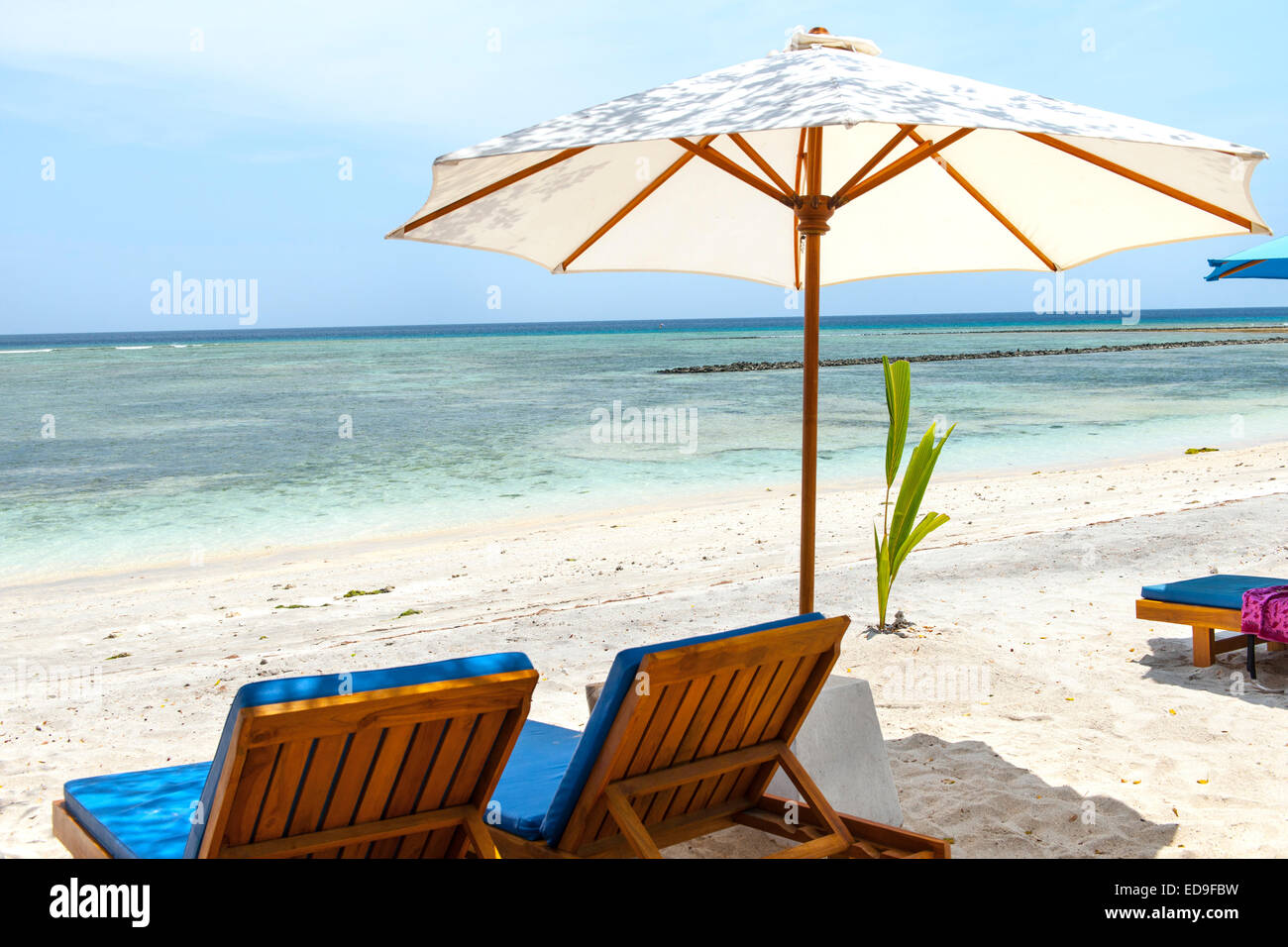 Beach loungers on Gili Air island, Indonesia. Stock Photo