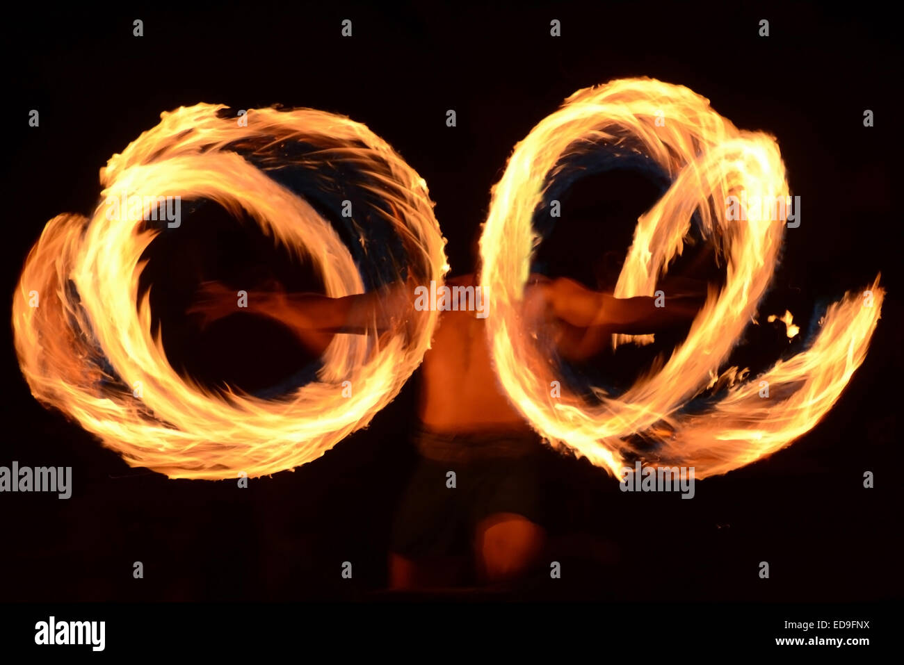 Traditional Samoan fire dancer practicing ancient ritual Stock Photo