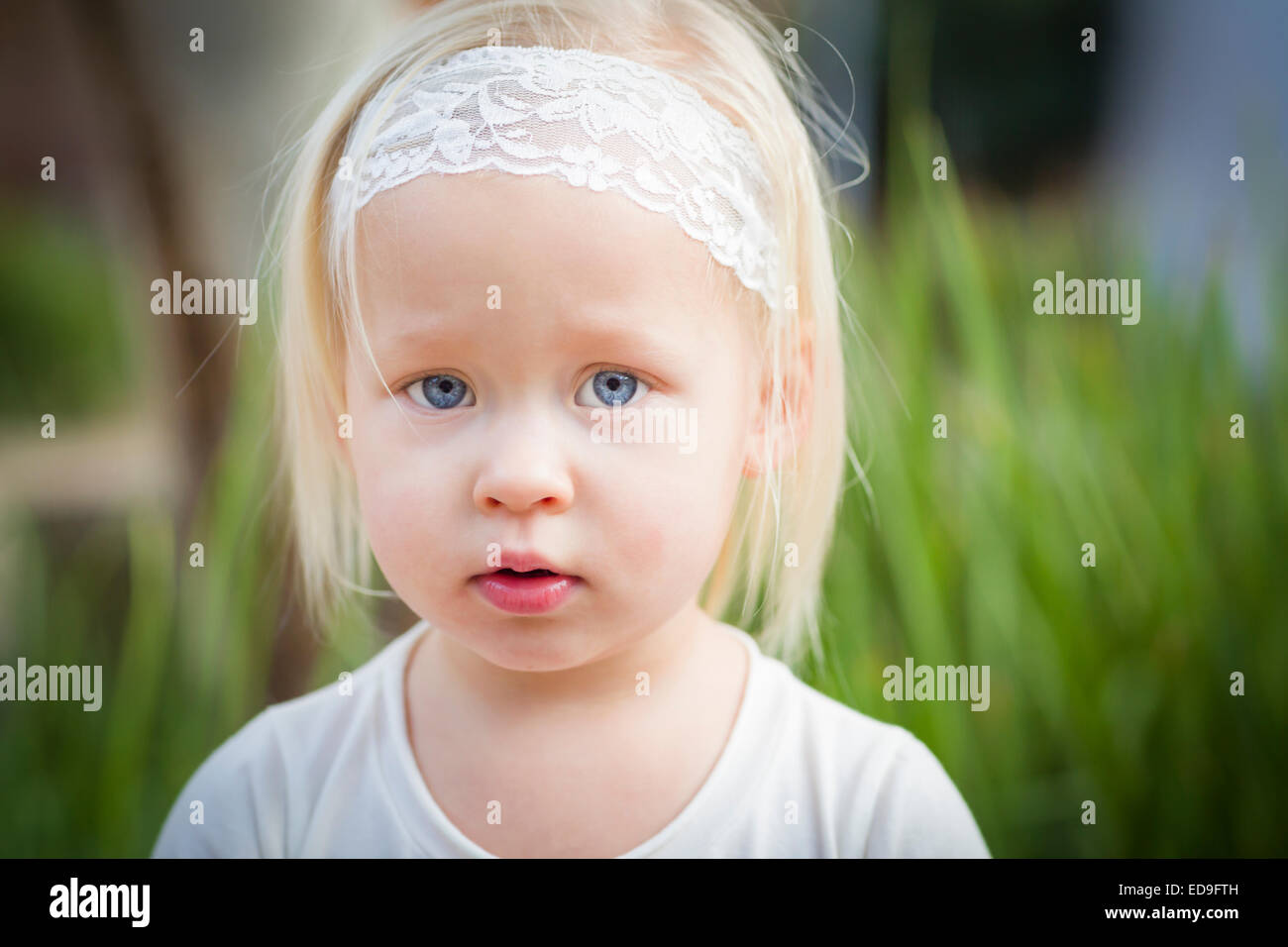 Adorable Little Girl with Blue Eyes Portrait Outside Stock Photo - Alamy
