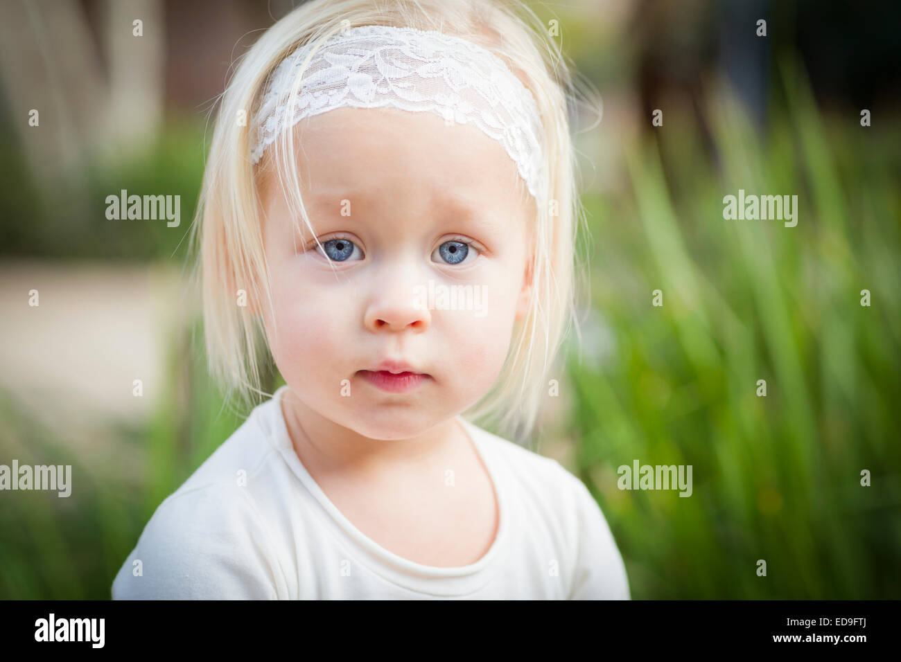 Adorable Little Girl with Blue Eyes Portrait Outside Stock Photo - Alamy