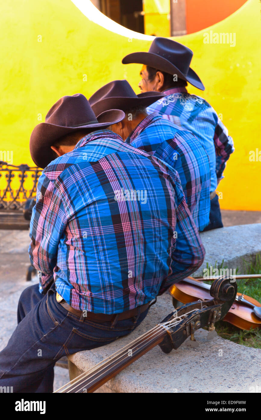 COWBOY musicians play traditional songs for a few pesos - SAN MIGUEL DE ALLENDE, MEXICO Stock Photo