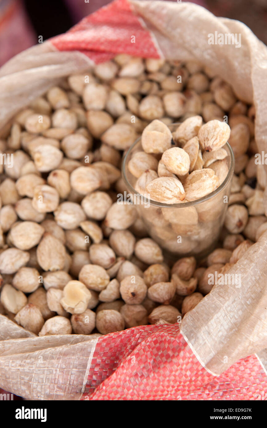 Macadamia nuts for sale in the market of Wuring fishing village near Maumere on Flores island, Indonesia. Stock Photo