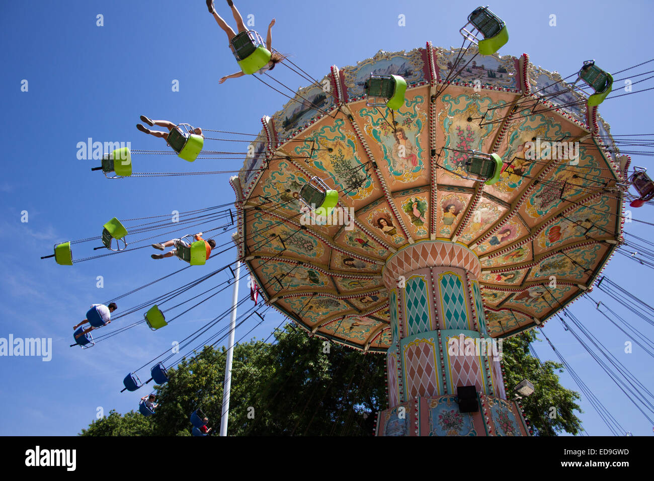 High flying fun on the carousel ride at the amusement park. Stock Photo
