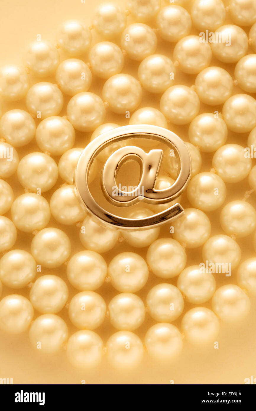 Email international sign on pearl necklace as background Stock Photo