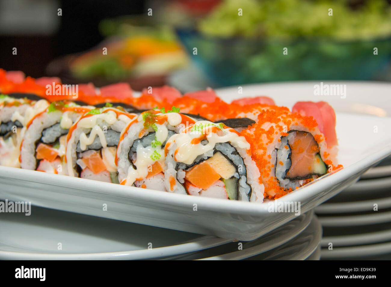 A Japanese seafood sushi roll on the white plate. Stock Photo