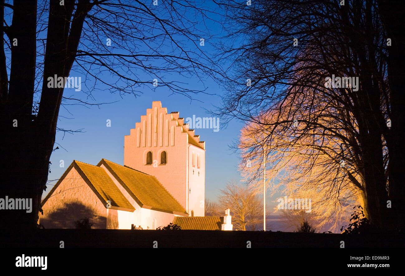 Small church in floodlight. Shot from Bjerager, Denmark, Stock Photo