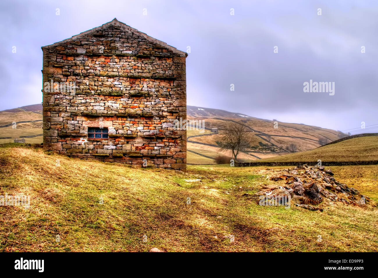 An all too familiar scene in Swaledale in the Yorkshire Dales National Park, and that being the barns. Image taken at Keld. Stock Photo