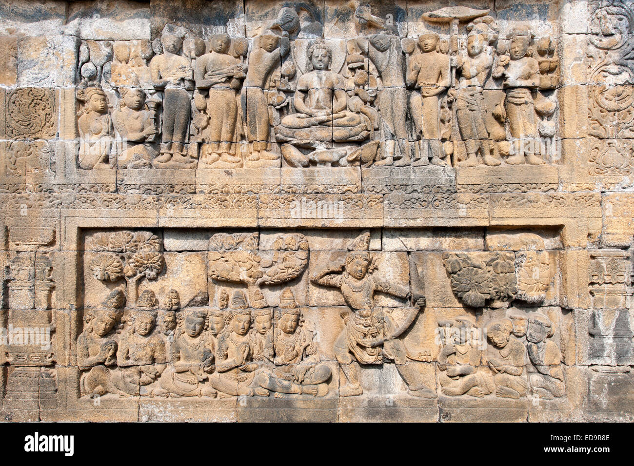 Karmawibhangga bas reliefs (160 of them) carved in the stone of Borobodur, a 9th-century Buddhist Temple in Magelang, Indonesia. Stock Photo