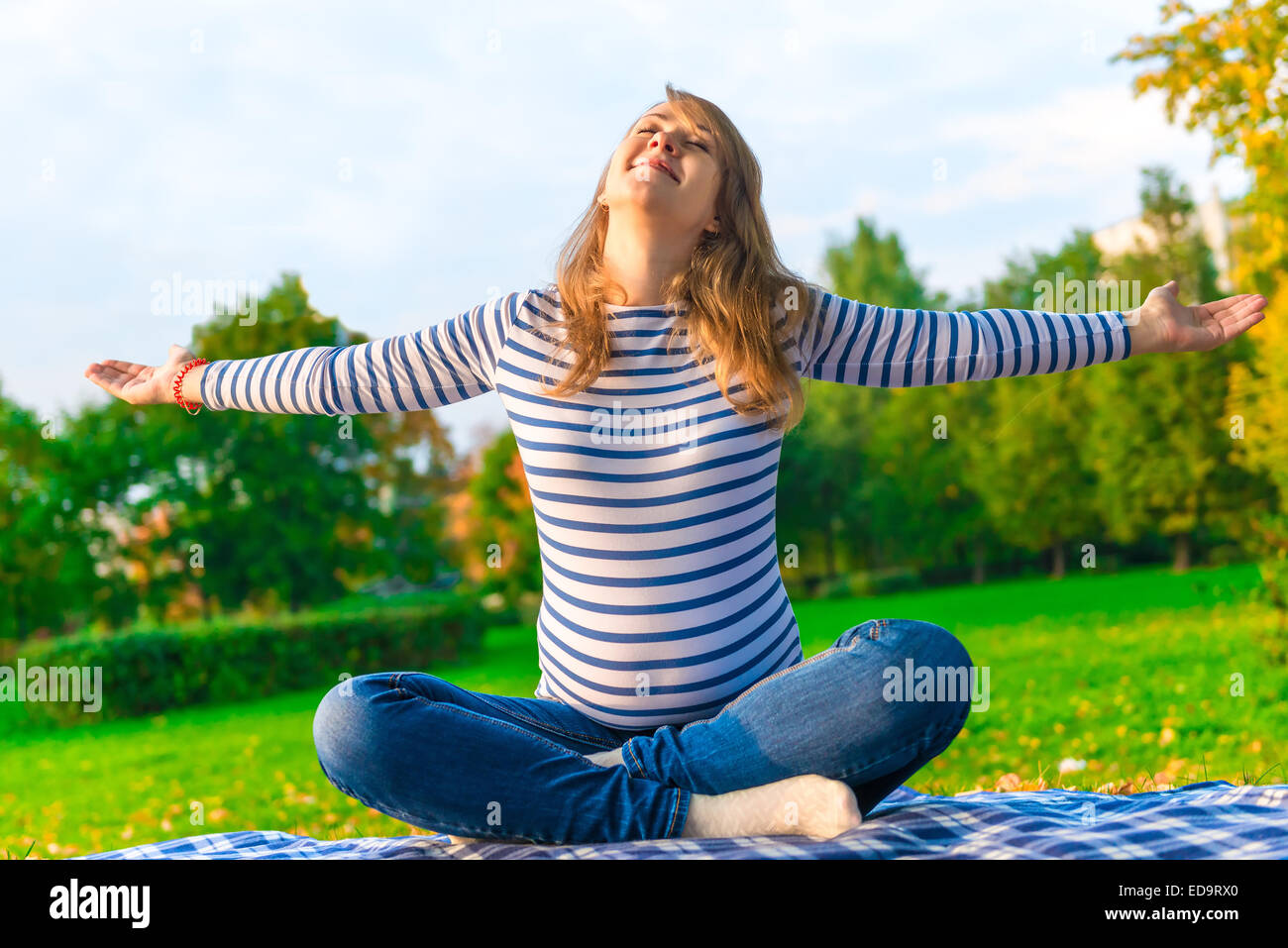 pregnant girl is preparing for the birth. doing breathing exercises on