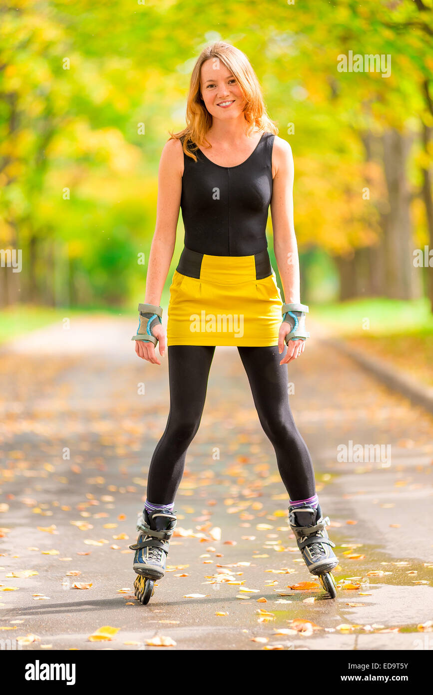 Happy active girl plays sports in the park Stock Photo